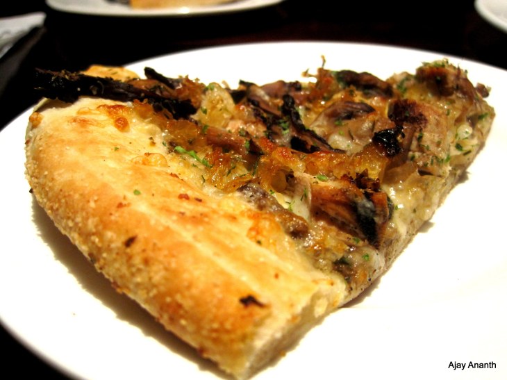 Wild Mushroom Pizza with grilled garlic chicken at California Pizza Kitchen, Bangalore, India